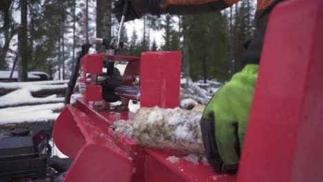 Hands-In-Gloves-Splitting-Birch-Firewood-With-Log-Splitter-In-Winter
