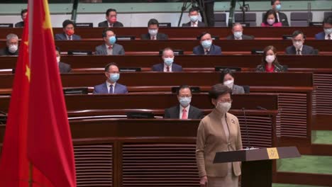 Former-Hong-Kong-Chief-Executive-Carrie-Lam-presides-next-to-the-People's-Republic-of-China-flag-while-is-seen-speaking-during-the-oath-taking-ceremony-at-the-Legislative-Council-main-chamber