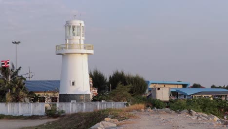 Historical-Lighthouse-In-The-Fishing-Port-of-Paknam-In-Rayong-River,-Eastern-Thailand