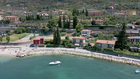 Aerial-truck-shot-of-houses-on-Lake-Garda-in-Italy