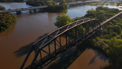 Aerial-view-of-an-old-steel-railway-bridge-on-the-river