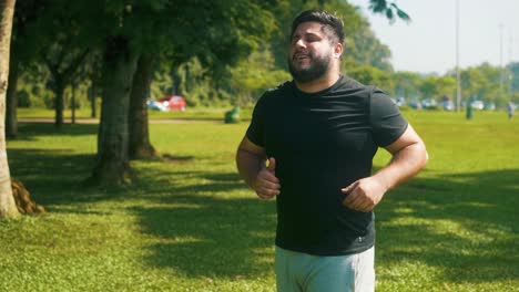 Young-man-jogging-at-the-park-on-a-sunny-summer-day