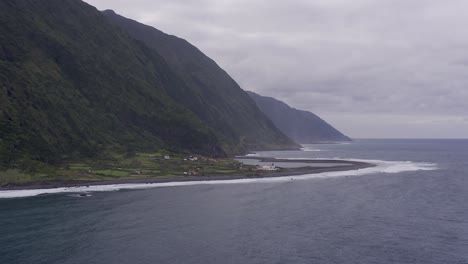 coastal-rural-village,-a-lagoon,-with-lush-green-cliffs-landscape,-FajÃ£-de-Santo-Cristo,-SÃ£o-Jorge-island,-the-Azores,-Portugal