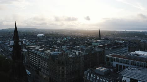 Establishing-aerial-view-of-Edinburgh,-Scotland-in-the-early-morning-light