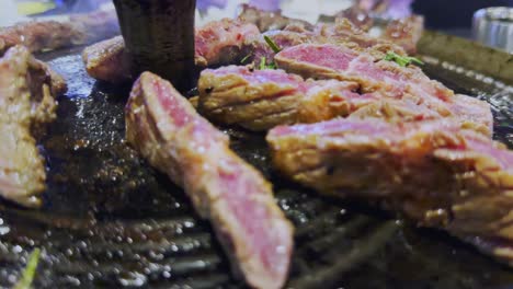 Cooking-meat-steak-on-traditional-Korean-bbq-grill