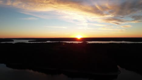 Aerial-shot-of-the-sun-rising-over-Lake-Monroe-in-Indiana