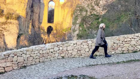 tracking-shot-of-a-tourist-walking-around-the-attractions-at-Ronda,-Spain
