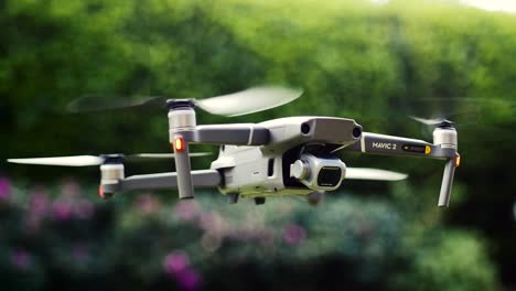 Drone-with-camera-on-gimbal-flying-in-slow-motion-inside-a-garden-DJI-Mavic-2-Pro