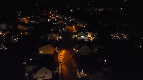 Lights-illuminate-large-houses-in-upscale-neighborhood-in-America-at-night