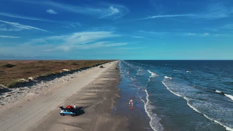 Idyllic-Scenery-Of-The-Beach-With-People-On-The-Shore-In-Padre-Island,-Texas,-USA---aerial-drone-shot