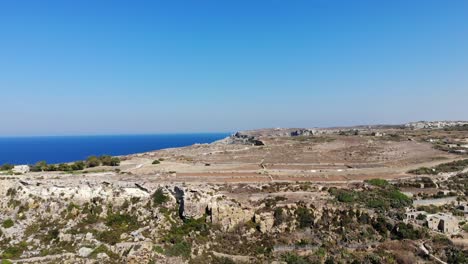 Gozo,Xaghra,Ramla-bay-panorama-of-rocky-cliffs-in-Malta-islands-aerial-landscape-view-of-mediterranean-sea-on-warm-summer-day