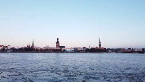 Iced-frozen-Daugava-river-in-Riga,-Latvia,-static-establisher-view,-dusk