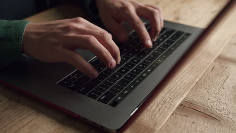 Hand-of-unrecognizable-person-typing-on-laptop-keyboard