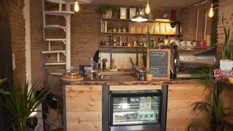 Wooden-Coffee-Bar-With-Coffee-Equipment-And-Pastries