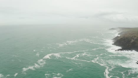 Aerial-rotation-from-the-open-Atlantic-Ocean-to-the-wild-misty-Cornish-coast