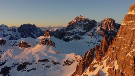Aerial-forward-tilt-down-view-of-beautiful-Italian-Dolomite-snowcapped-Unesco-mountains
