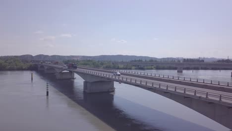 Rhone-Road-Bridge,-Busy-Highway-Traffic,-South-France,-Medium,-Aerial-Circling