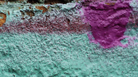 Dolly-in-shot-of-an-old,-painted-wall