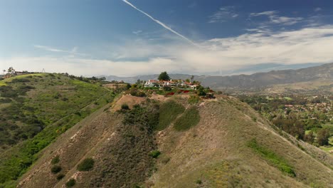 Aerial-view-of-a-mansion-on-top-of-a-mountain-in-Santa-Barbra,-California