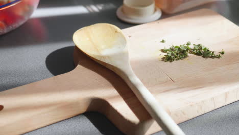 Chopped-oregano-on-a-wooden-board-in-the-summer-sunlight