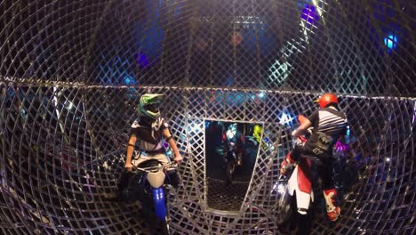 five-motocrosser-in-a-iron-cage-driving-out-to-the-stage-for-beginning-of-the-show