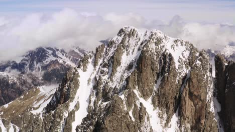 Aerial-circling-of-snow-capped-Cima-d'Asta-peak-in-Trentino