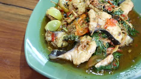 Close-Up-Footage-of-Thai-Hot-and-Spicy-Stir-Fried-Cat-Fish-and-Herbs