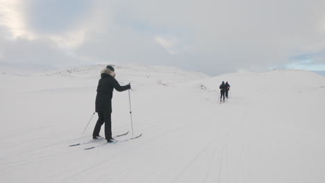 Group-of-cross-country-skiers-out-exercising-on-a-cold-Swedish-mountain-on-a-ski-trail