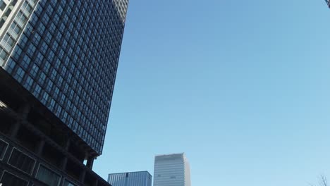 POV-to-the-sky-with-many-skyscraper-office-building-in-the-big-city