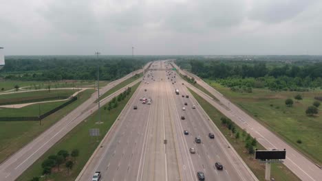 Establishing-aerial-shot-of-cars-on-59-South-in-Sugarland,-Texas-just-outside-of-Houston