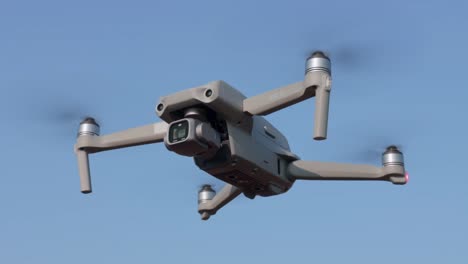 DJI-Drone-or-UAV,-Air-2s-model-with-ADSB-hovers-against-blue-sky