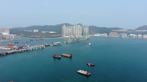 Hong-Kong-cross-bay-link-construction-project,-a-dual-two-lane-bridge-connecting-Tseung-Kwan-O-Lam-Tin-Tunnel-to-Wan-Po-Road,-Aerial-view