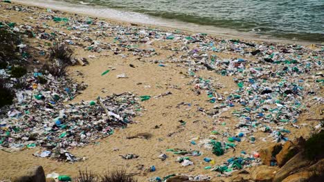 Landscape-of-beach-polluted-by-plastic-rubbish,-climate-change-concept