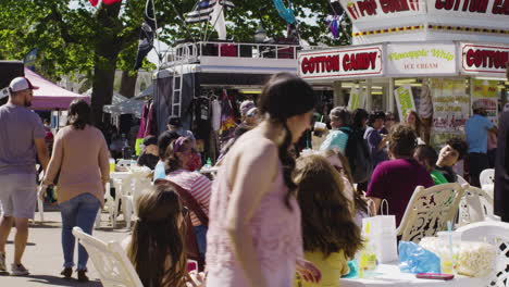 Hordes-of-people-attending-Dogwood-Festival-browse-food-stalls-in-Siloam-Springs,-Arkansas