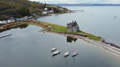 Aerial-view-of-Lochranza-Castle-on-the-Isle-of-Arran-on-an-overcast-day,-Scotland