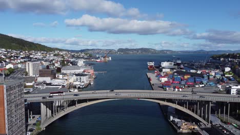 Puddefjord-bridge-with-passing-traffic-on-a-sunny-summer-day---Forward-moving-aerial-Bergen-Norway