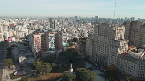 Aerial-dolly-in-flying-over-Houssay-Square-near-public-Faculty-of-Medicine-and-Clinic-Hospital,-Buenos-Aires