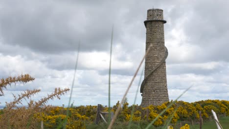 Flue-Chimney-Ruin-Surrounded-By-Gorse-Shrubs-In-Carrickgollogan-Hill-On-A-Cloudy-Day