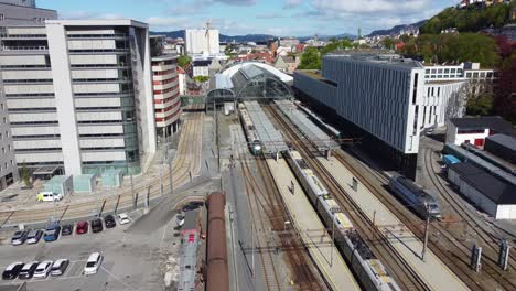 Train-from-Oslo-at-Bergensbanen---arriving-Bergen-station---Aerial-following-train-into-station-area---Norway