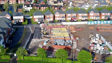 Construction-site-aerial-view-above-new-urban-real-estate-housing-development-regeneration-left-dolly
