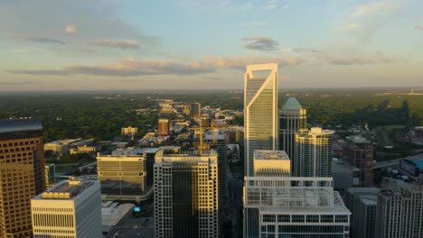 Drone-Flies-High-Above-Charlotte-Skyscrapers-during-Dramatic-Sunrise