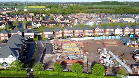 Construction-site-aerial-view-above-new-urban-real-estate-housing-development-regeneration-pull-away-zoom-out