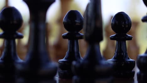 Black-pawns-in-focus-on-a-set-game-of-chess