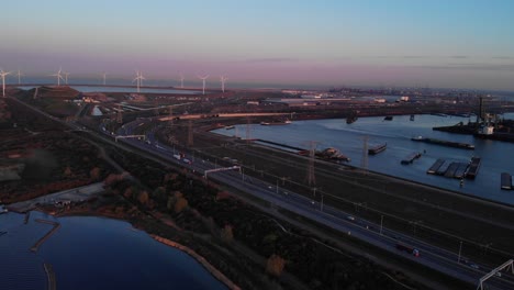 Seaport-Of-Maasvlakte-Along-With-The-Windmills-In-Rotterdam,-Netherlands-At-Dusk