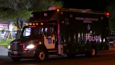 forensic-identification-services-truck-from-Toronto-police-parked-on-street,-at-night