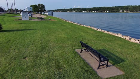 Drone-flight-over-an-empty-park-bench-looking-over-the-mighty-Mississippi-river-in-Iowa