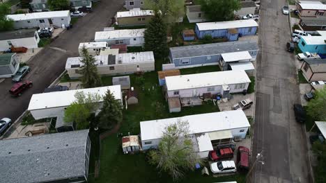 Run-down-single-and-double-wide-trailers-in-a-mobile-home-park-showing-wealth-disparity-in-2021