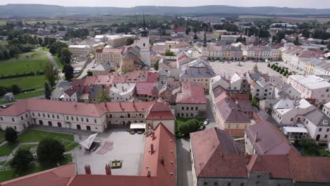 Slow-flight-over-the-historical-part-of-the-city-and-the-square-in-Moravian-Třebová,-Czech-Republic