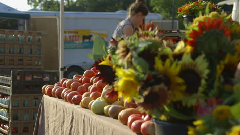 Flowers-And-Fruits-In-A-Stall-At-The-Farmer's-Market-In-Durham,-North-Carolina-On-A-Sunny-Morning