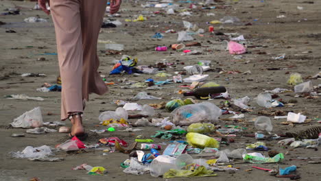 Girl-Walks-On-Seashore-With-Plastic-Garbage---Polluted-Beach-At-Mui-Ne,-Binh-Thuan,-Vietnam